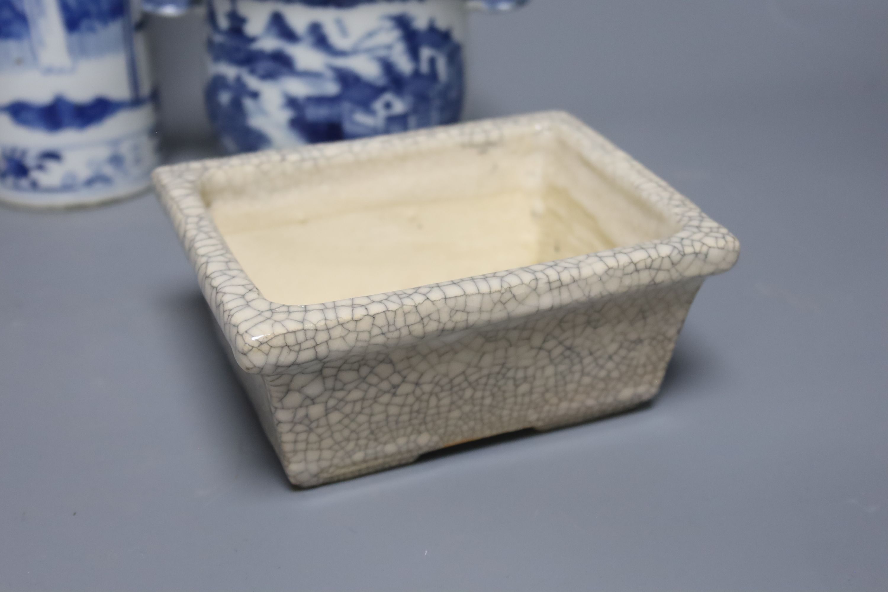 An early 20th century Chinese blue and white sleeve vase, together with a blue and white jar and cover and bowl, and a crackle glaze censer, tallest 21cm